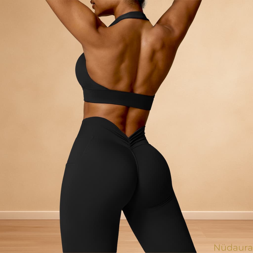 Nüdaura AeroForm Set – Classic Black color, back arch pose with halter top and ruched leggings.