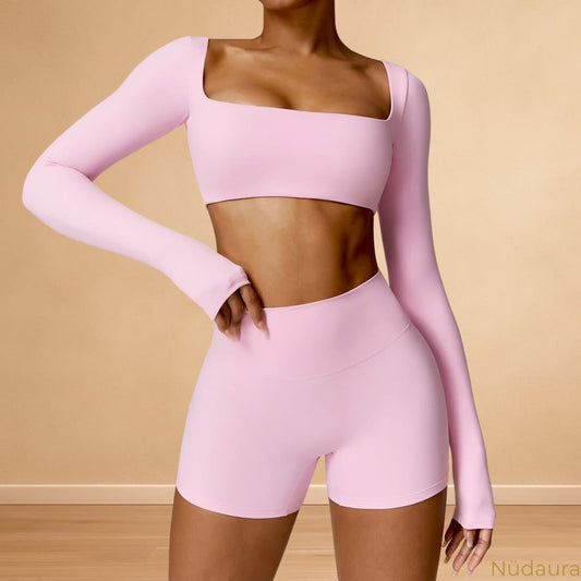 Nüdaura ContourFlow Seamless Suit – Light Pink color, front view pose.