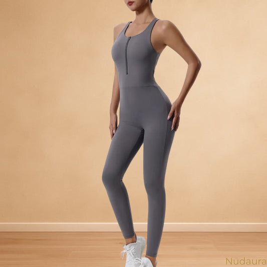 Nüdaura OneFlow Jumpsuit – Charcoal Gray color, front zip pose.