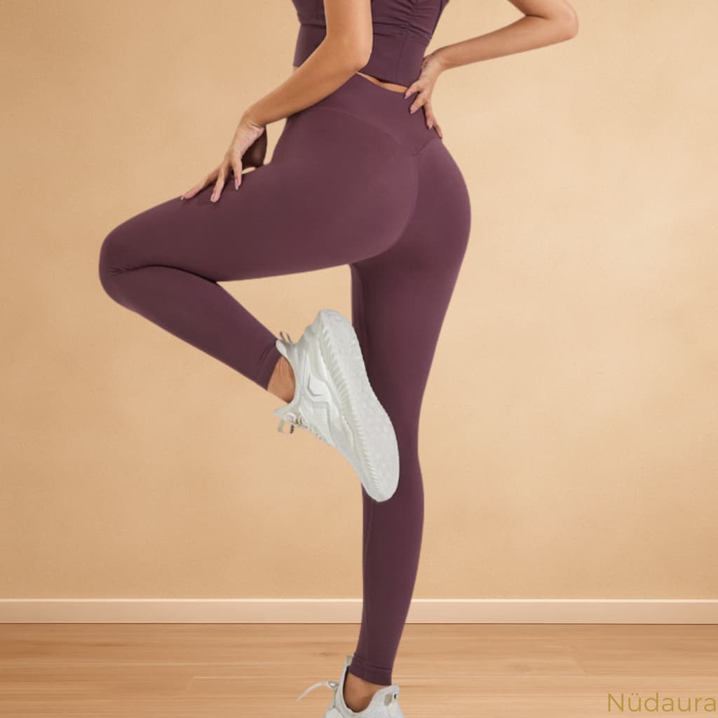 Nüdaura PocketFit Leggings – Berry Red color, leg lift pose.