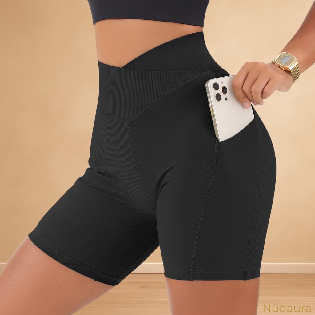 Nüdaura RibCross Shorts – Classic Black color, side pocket pose with phone.