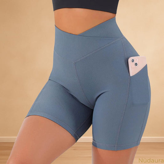 Nüdaura RibCross Shorts – Cool Blue color, front pocket pose.