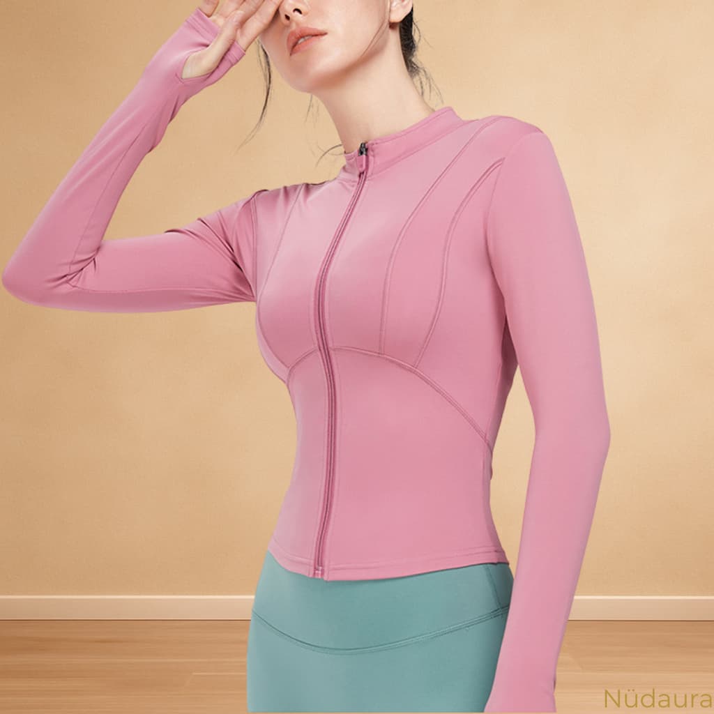 Nüdaura ThermalFlow Jacket – Soft Pink color, front gesture pose.